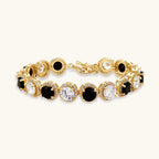Gold-plated jewelry set with alternating black and clear cubic zirconia stones, featuring necklace, earrings and bracelet