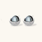 Necklace and stud earrings set with silver-gray domed centers in white gold plated eco-brass shells pavé-set with zirconia.