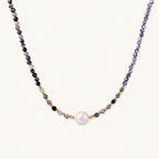 Dainty necklace with faceted purple iolite beads, gold vermeil accents, and central pink-white freshwater pearl.