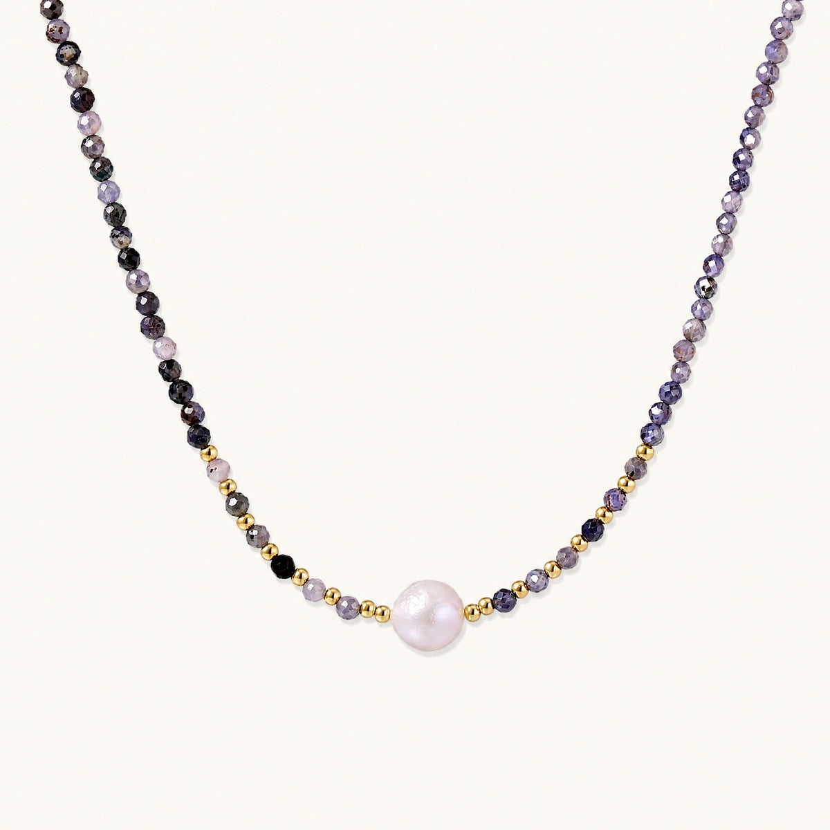 Dainty necklace with faceted purple iolite beads, gold vermeil accents, and central pink-white freshwater pearl.